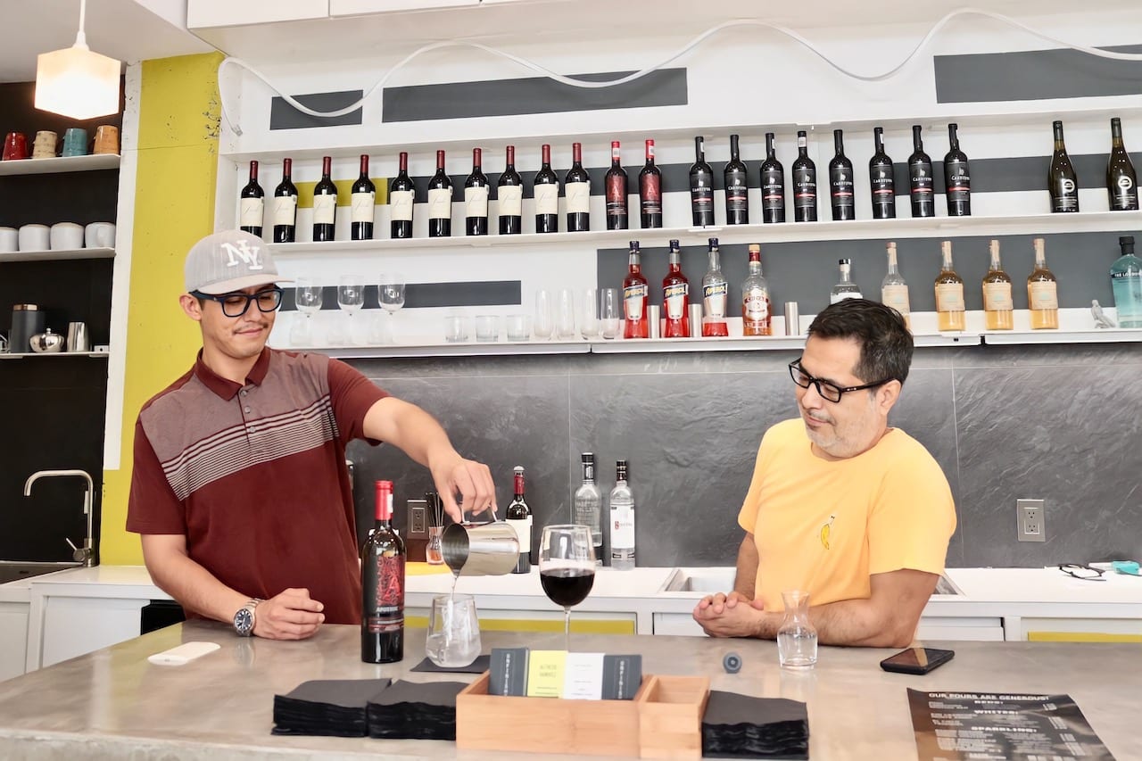 Rubicel Aquino and Alfredo Ramirez at the bar in Unfinished Gallery. Photo by Oscar Almeida
