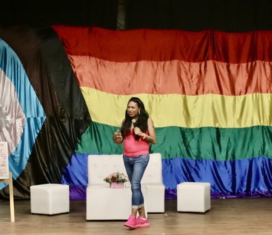 Strengthening Community: Te Cuido, Me Cuido 2024, A Free Health Initiative Activist Kenya Cuevas at conference for Vallarta Pride 2024 by photographer Oscar Almeida