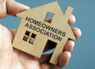 When to Start Paying HOA Fees in Puerto Vallarta and Riviera Nayarit Pre-Sales Homeowners Association HOA written on a model of home