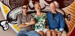 (left to right) Juan Sebastian Palafox, Brian Scott Carey, and Philip Wier, owners of the new restaurant Salchidogo. Photo by Oscar Almeida.