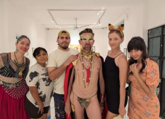 Art, Fashion, and Identity Converge at Arte Vallarta Museo’s La Pasarela Felix d'Eon is flanked by his models from the fashion show.