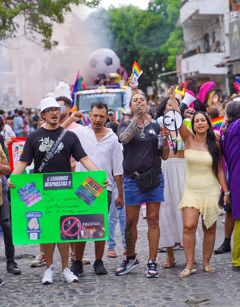Juan Manuel López (left) raising his voice in support of his cause during Vallarta Pride 2026, alongside activists such as Kenya Cuevas and local councilwoman Melissa Madero.