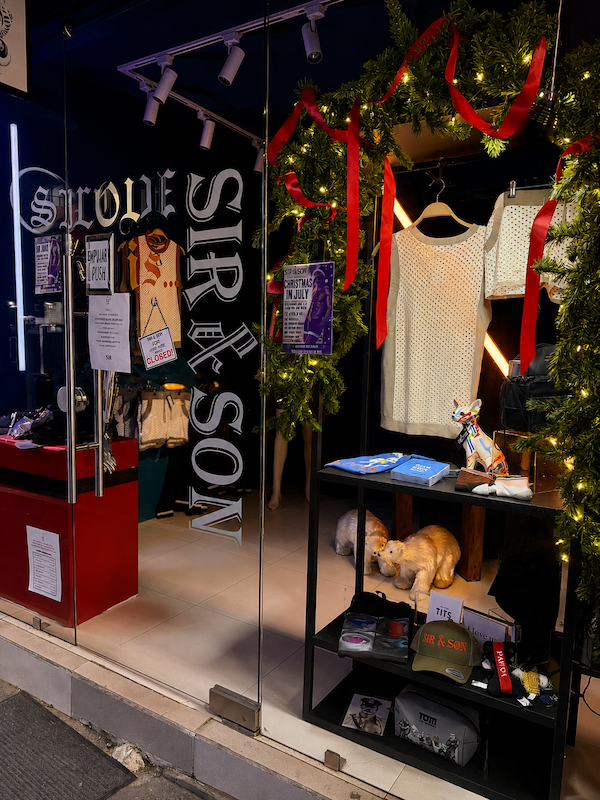 sir and son christmas in july store window