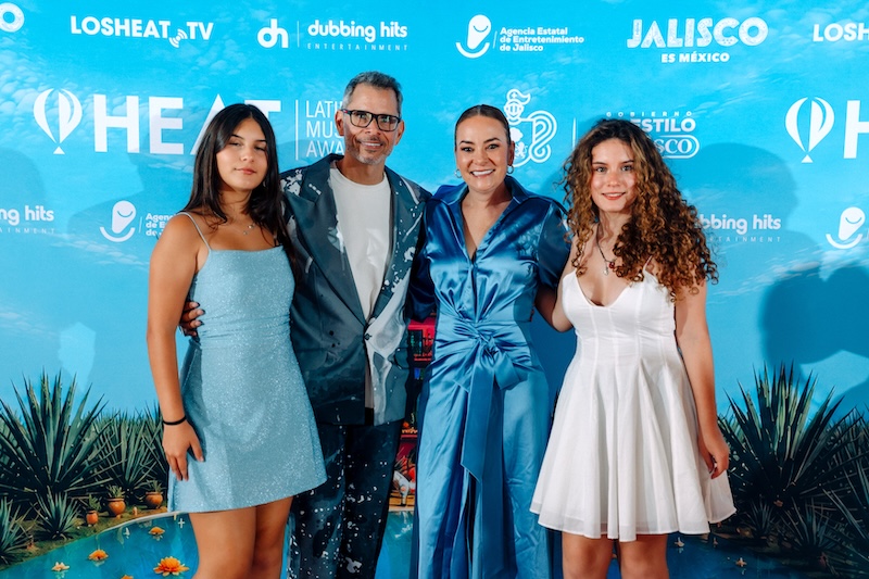 Diana Montes (center right, in the blue satin dress) is the founder and executive director of the HEAT Latin Music Awards. Photo from the Miami, FL announcement. Photo Provided.